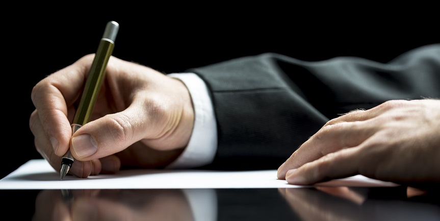 Businessman Writing A Letter Or Signing